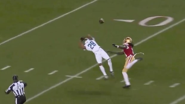 Brandon Aiyuk tracks down the ball against the Lions.